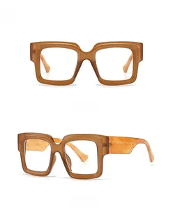 Detailed view of oversized tea-colored blue light blocking glasses with gradient frames