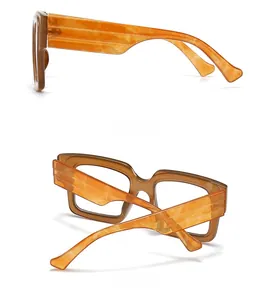 Detail view of stylish amber-patterned square frame glasses with wide temple design