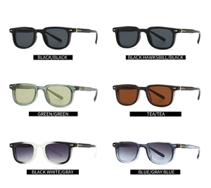 Detail view of square sunglasses showing multiple color frames and arrow metal accents