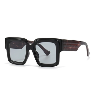 Retro square oversized blue light glasses with black frames and marble textured temples