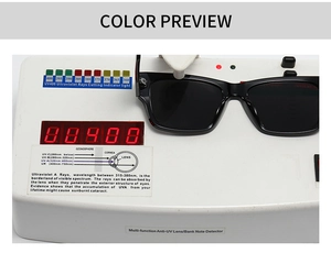 Detail showing square black sunglasses under UV400 protection test device