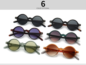 Vue à plat de lunettes de soleil rondes vintage en six couleurs dont écaille et ambre