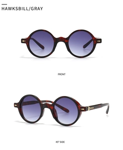 Détails de lunettes de soleil rétro en écaille avec verres dégradés violets et accents dorés