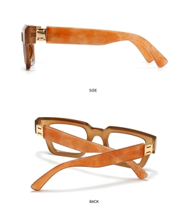Detail view of amber tortoiseshell frame temple and gold hinge decoration on these glasses