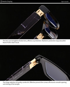 Detailed macro view of black frames with marble pattern temples and durable gold metal hinges