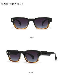 Detail view of vintage sunglasses with black to amber frames and blue gradient lenses