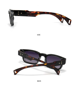 Detail view of vintage square sunglasses with tortoiseshell temples and star rivets
