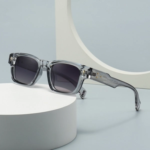 Retro square transparent gray sunglasses with gradient lenses and gold rivet accents