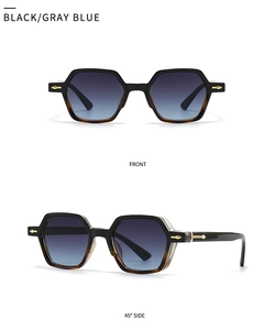 Detail view of narrow polygon sunglasses with black tortoiseshell frames and gold hinges