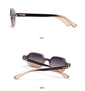 Detail view of hexagonal sunglasses showing the gradient lenses and gold metal arrow decor