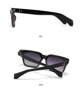 Detail view of square sunglasses featuring golden triple rivets on high-quality black frames