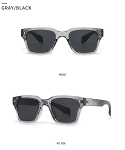 Détail de lunettes de soleil rectangulaires gris translucide avec rivets dorés et verres