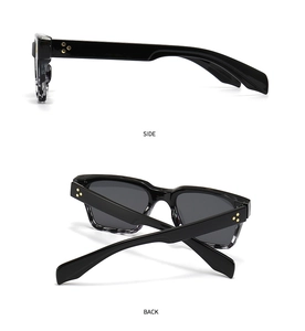 Vue détaillée des lunettes de soleil carrées noires avec rivets en forme d'étoile dorée