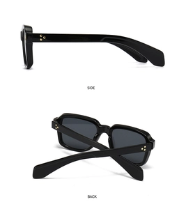 Detail view of black square sunglasses featuring golden star rivets and side-back angles