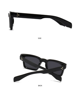 Vue détaillée des lunettes de soleil œil-de-chat noires avec rivets dorés style léopard