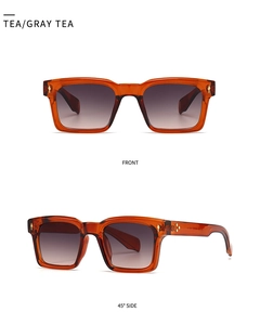Vue de face et de profil de lunettes de soleil œil-de-chat thé avec rivets dorés