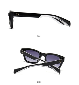 Detail of square sunglasses with purple gradient lenses and gold star rivets on side
