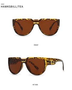 Détails des lunettes de soleil écailles, verres thé, pont doré et logo C latéral