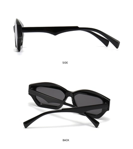 Detail view showing the side and back of black geometric cat-eye sunglasses with thick frames