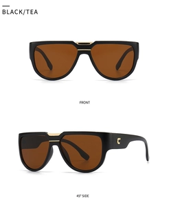 Vues de face et de profil à 45 degrés de lunettes papillon avec barres dorées et logo C