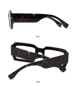 Detail view of bold square frame glasses featuring purple marble texture on temple arms