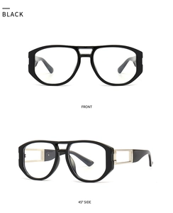 Details einer glänzenden schwarzen quadratischen Sonnenbrille mit Goldsteg