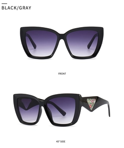 Macro detail of retro cat-eye sunglasses featuring black frames and purple gradient lenses