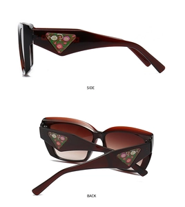 Detail view of tortoiseshell sunglasses featuring floral triangle inlays on the temples