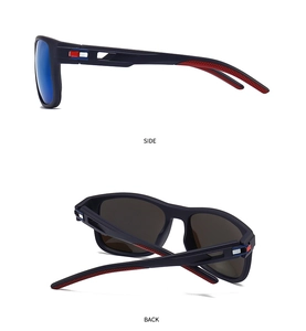 Detail of matte black sunglasses with blue mirrored lenses and red honeycomb anti-slip pads