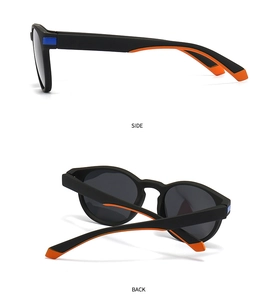 Detail view of square polarized sunglasses with matte black frames and orange side accents