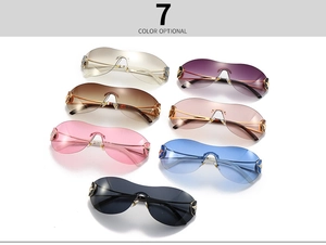 Detailed view of frameless shield sunglasses in seven colors with star metal accents
