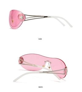 Detail view of pink rimless sunglasses with star metal ornaments and white temple tips