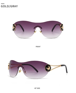 Detail view of gold oversized sunglasses with gradient lenses and star emblem on temples
