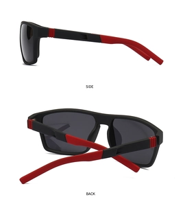 Detail view of sports sunglasses featuring black matte frames with red anti-slip accents