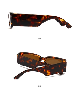 Detail view showing side and back of tortoiseshell rectangular sunglasses with dark lenses