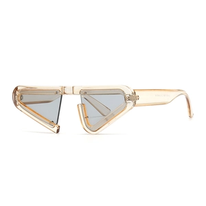 Champagne triangular cat eye sunglasses with grey lenses and unique geometric frame