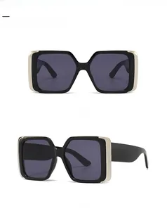 Front and side view of black square sunglasses with decorative gold metal hinges