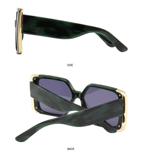 Side and back view of cat eye sunglasses with green marble frame and gold metal accents