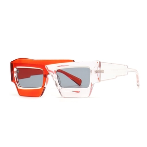 Lunettes de soleil rectangulaires avec monture asymétrique orange et rose translucide