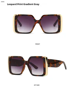 Detail view of modern leopard print cat-eye sunglasses with purple gradient lenses