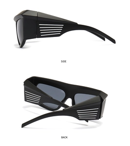 Side and back view of matte black oversized cycling sunglasses with white stripe detail