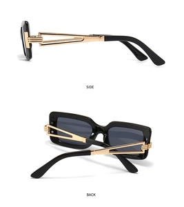 Detail of square black sunglasses showing hollow geometric gold metal temples
