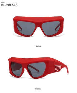 Detail view of red futuristic oversized sports sunglasses with white stripe accents