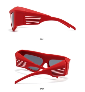Side and back view of red oversized futuristic wrap sunglasses with gray lenses