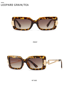Detailed macro view of vintage leopard print sunglasses with golden metal hinges and tea lenses