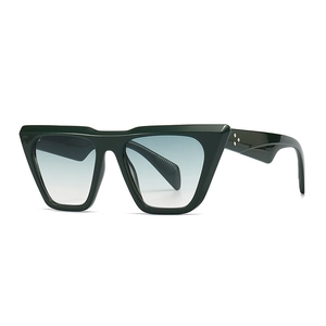 Cat eye sunglasses in dark green frame with light blue gradient lenses and star accents