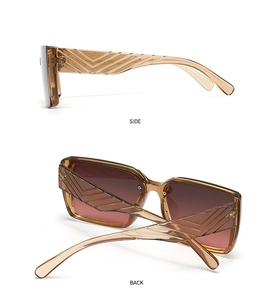 Detail view of brown translucent sunglasses frame with stylish textured temples and hinges