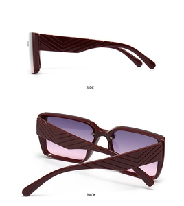 Side and back view of burgundy oversized sunglasses with textured chevron temples