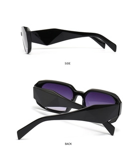 Detail view of black square sunglasses featuring purple gradient lenses and geometric arms
