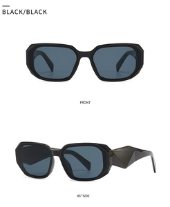 Detail view of black rectangular sunglasses with geometric frame and 3D textured temples